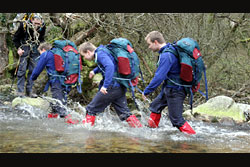 Chris walking in a river