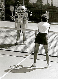 A robot playing tennis with a lady