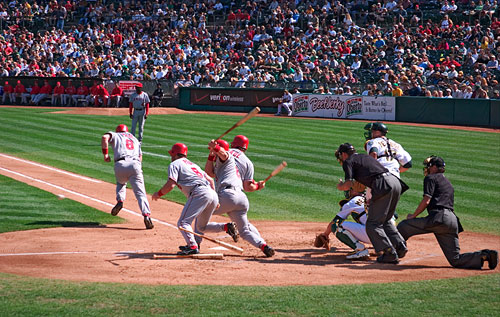 A montage of a baseball batter striking the ball at the Oakland Coliseum