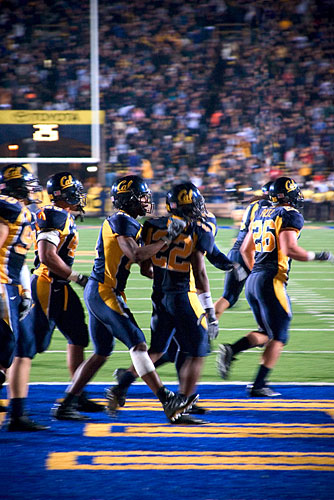 American football platers celebrate a touchdown